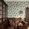 Weathered Green Cowboy Wallpaper styled in a rustic sitting room with leather chairs, wood window trim, framed art, and vintage Western cowboy wallpaper
