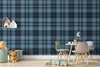 Blue Tartan Plaid wallpaper styled in a kids room with small table, chairs, toys, shelf decor, and blue plaid nursery wall pattern
