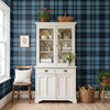 Blue Tartan Plaid wallpaper styled in a cottage entryway with white cabinet, wood bench, window light, plants, baskets, and classic farmhouse plaid walls
