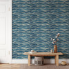 Navy blue abstract ocean wave wallpaper creating a dimensional entryway accent wall