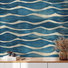 Large-scale coastal wave wallpaper in a bright children’s room with contemporary furnishings