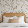 Bird wallpaper with pastel botanical details and chinoiserie branches styled in a nursery