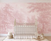 Blush pink landscape wallpaper mural in a baby nursery with soft vintage countryside artwork