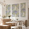 Large floral nursery wallpaper with dusty sage background, purple flowers, cream blossoms and yellow botanical details
