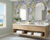 Sage green floral bathroom wallpaper with oversized vintage botanical flowers above a vanity
