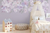 Floral wall decals used as a lavender watercolor border in a girls room or playroom