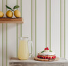 English cottage stripe wallpaper displayed in breakfast nook with fresh lemons and soft natural light