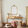 Charlotte Stripe bathroom wallpaper with gold fixtures and French country inspired styling