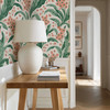 Retro Scandinavian botanical wallpaper with green leaves and coral flowers in an entryway