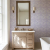 Luxury vanity with Eleanor Lavender Roses lavender floral wallpaper in a romantic English cottage bathroom.