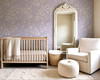 English cottage nursery featuring Eleanor Lavender Roses wallpaper with vintage crib and cozy reading chair.