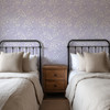 Twin bedroom with Eleanor Lavender Roses floral wallpaper creating a romantic English cottage retreat.