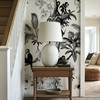 Traditional hallway decorated with vintage tropical monkey wallpaper and botanical palm trees