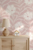 Bethany pink abstract floral wallpaper in a modern nursery featuring oversized blush botanical flowers