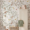Gender neutral woodland wallpaper with soft botanical green leaves and animal details