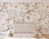 Nursery wallpaper with delicate branches, birds, butterflies, and cottage woodland animals