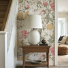 Vintage botanical wallpaper decorating an entryway table with soft pink roses and yellow floral pattern. Pattern Repeat 52