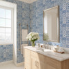 Blue Mediterranean tile wallpaper in bathroom with light wood vanity, 13-inch repeat