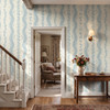Elsie Heritage Blue floral stripe wallpaper in 52 inch repeat styled in an entryway staircase with wood console table, doorway, wall sconce, flowers, and French country decor