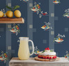 Fruit Compote Navy Blue retro kitchen wallpaper in 26 inch repeat shown with lemonade pitcher, fruit shelf, cake, and vintage kitchen decor