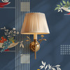 Fruit Compote Navy Blue retro dining room wallpaper in 26 inch repeat shown close up with bronze wall sconce and mid century fruit bowl pattern