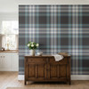 Teal blue plaid wallpaper shown behind a rustic wood cabinet near a bright kitchen windowNavy grey tartan wallpaper with teal blue and cream plaid pattern in a farmhouse kitchen accent wall 52 REPEAT