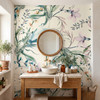 Eden Watercolor Floral Wallpaper styled in a bathroom vanity with round wood mirror, vessel sink, natural wood vanity, and bohemian floral wall decor