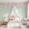 Delaney Jasmin pink floral canopy wall decal with blush watercolor flowers above a canopy bed on a soft sage green bedroom wall