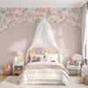 Delaney Jasmin floral canopy wall decal with pink watercolor flowers framing a blush canopy bed on a soft pink bedroom wall