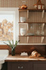 Small-scale Elsie Sunbaked Clay wallpaper above a farmhouse kitchen counter, 13 inch repeat