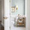 Small-scale Elsie Aquamarine light teal wallpaper above white bathroom wainscoting, 13 inch repeat