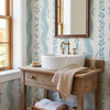 Elsie Aquamarine light teal floral wallpaper behind a vessel sink and rustic wood vanity, 52 inch repeat
