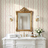 Elsie Grandmillennial Pink Stripe Wallpaper in Elegant Bathroom With Gold Mirror