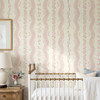 Elsie Pink Floral Stripe Wallpaper in Nursery With Brass Crib