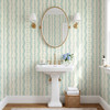 Elsie Ivory Mint Floral Stripe Wallpaper in Powder Room With Pedestal Sink and Round Mirror