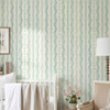 Elsie Ivory Mint Floral Stripe Wallpaper in Nursery With White Crib and Calm Mint Green Palette