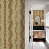Elsie Walnut and Butter large-scale botanical stripe wallpaper connecting a bedroom hallway with a dark wood bathroom vanity
