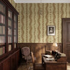 Elsie Walnut and Butter large-scale wallpaper in a traditional home library with dark wood bookcases and paneled walls