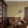 Small-scale heritage botanical wallpaper in a traditional library with dark wood bookcases, paneling and an antique desk
