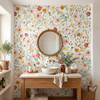 Madison floral bathroom wallpaper with a finer arrangement of pink and yellow flowers behind a round wood-framed mirror, white vessel sink and wooden vanity.