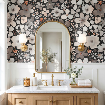 Skylar black floral wallpaper with oversized watercolor flowers in a bathroom with brass arched mirror, white vanity and warm wood accents