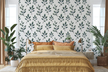 Fergus blue green botanical wallpaper styled in a cozy bedroom with natural wood furniture and small scale watercolor leaf design