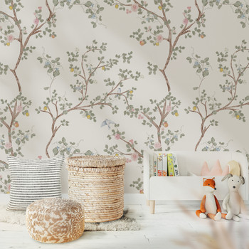 Chinoiserie wallpaper with soft botanical branches and birds styled in a neutral nursery