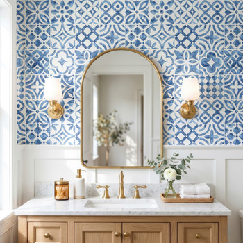 Blue Moroccan bathroom wallpaper behind wood vanity and arched mirror, 26-inch repeat