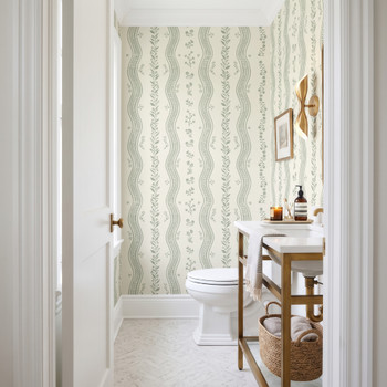Elsie Ivory Sage floral stripe wallpaper in a farmhouse bathroom with a wooden vanity, 52 inch repeat