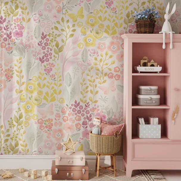 Pink and Yellow Floral Meadow Wallpaper styled in a girls playroom with pink bookshelf, woven basket, toys, and cheerful butterfly floral wall decor