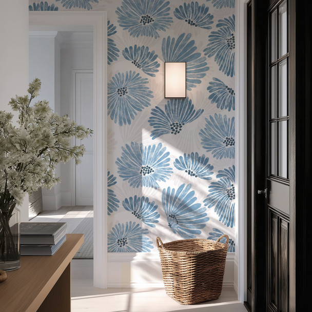 Linnea blue watercolor floral wallpaper in 52 inch repeat styled in an entryway with black door, woven basket, wall sconce, and natural light