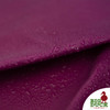Water droplets beading on Bodacious Pink waxed canvas surface—non-toxic wax coating provides lasting water resistance and a classic vintage look