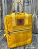 Waxed canvas backpack in Lemon Curry yellow, sewn from 10oz cotton duck fabric. Naturally water-repellent and built to last—perfect for outdoor, travel, or everyday adventure projects.