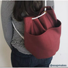 Backpack sewn from Beet Red cotton duck — 10oz preshrunk canvas with deep red color and rugged durability.